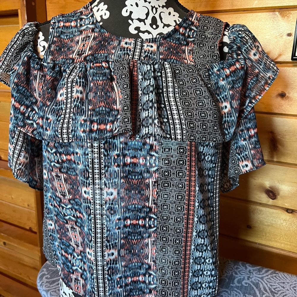 BCBGMaxAzria cold shoulder, short sleeve blouse with ruffles.